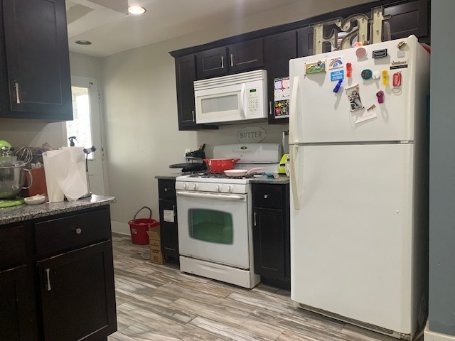 514 Marcy Street Ottawa, IL 61350 - Photo 6 of 54 a white refrigerator freezer sitting inside of a kitchen
