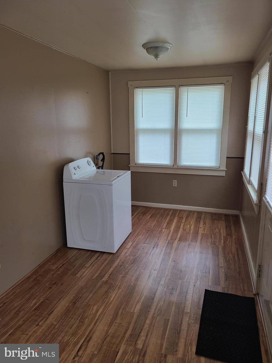 16 Waterworks Road Salem, NJ 08079 - Photo 5 of 11 an empty room with wooden floor and windows