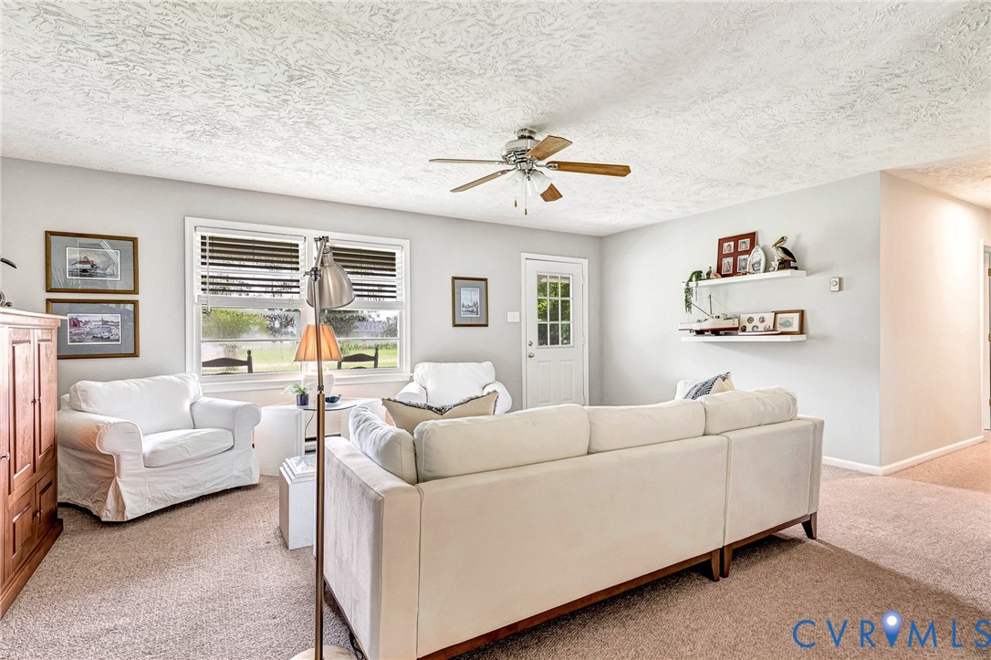 635 River Oaks Road Center Cross, VA 22437 - Photo 17 of 63 Living area featuring light gray wall paint and te