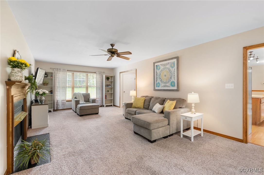 12207 Balta Road Chesterfield, VA 23838 - Photo 12 of 50 Carpeted living area with a ceiling fan, a firepla