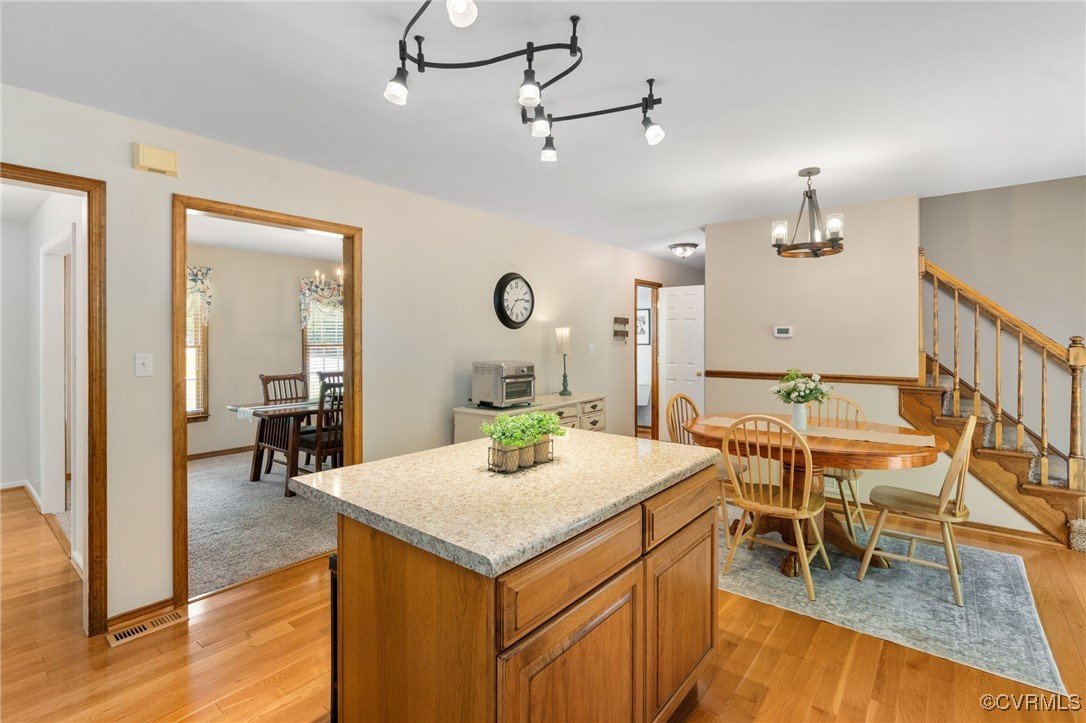 12207 Balta Road Chesterfield, VA 23838 - Photo 17 of 50 Kitchen featuring a chandelier, light wood-style f