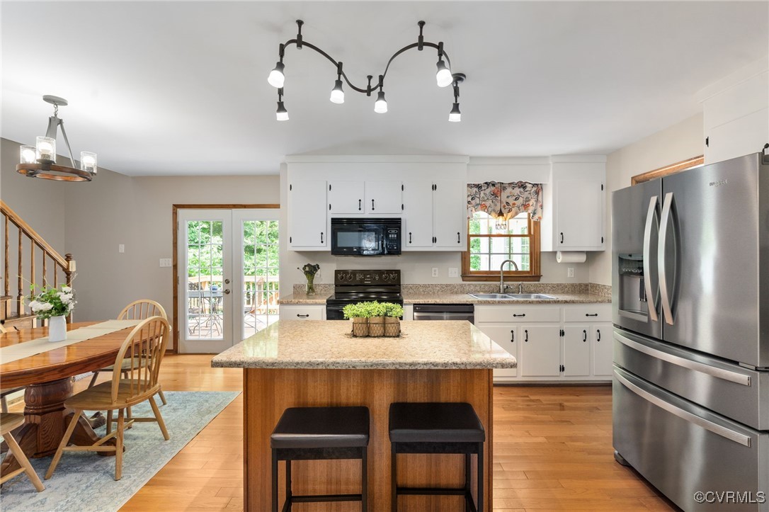 12207 Balta Road Chesterfield, VA 23838 - Photo 19 of 50 Kitchen featuring black appliances, a sink, health
