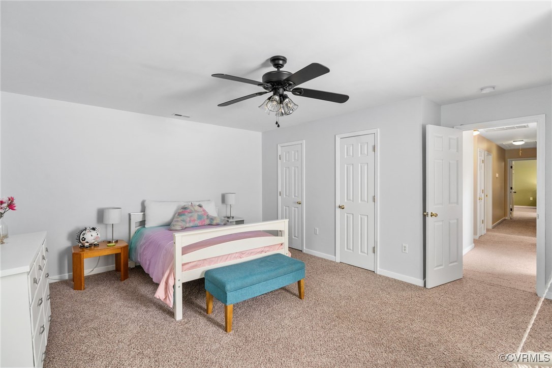 12207 Balta Road Chesterfield, VA 23838 - Photo 26 of 50 Bedroom featuring light carpet, multiple closets,