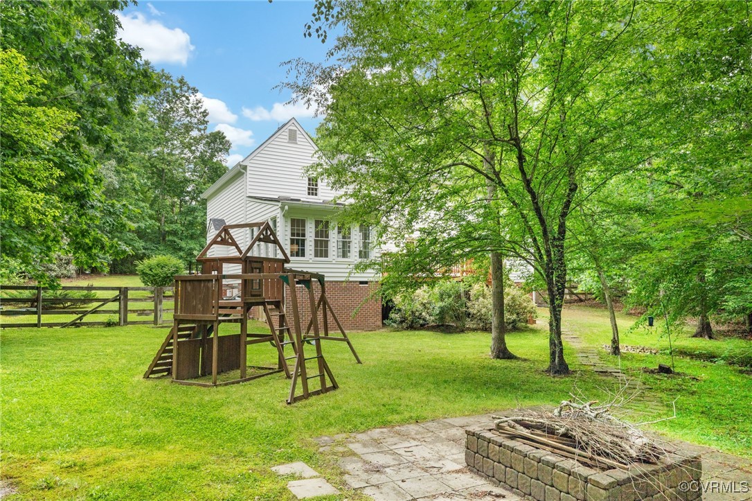 12207 Balta Road Chesterfield, VA 23838 - Photo 44 of 50 View of yard featuring a playground and an outdoor