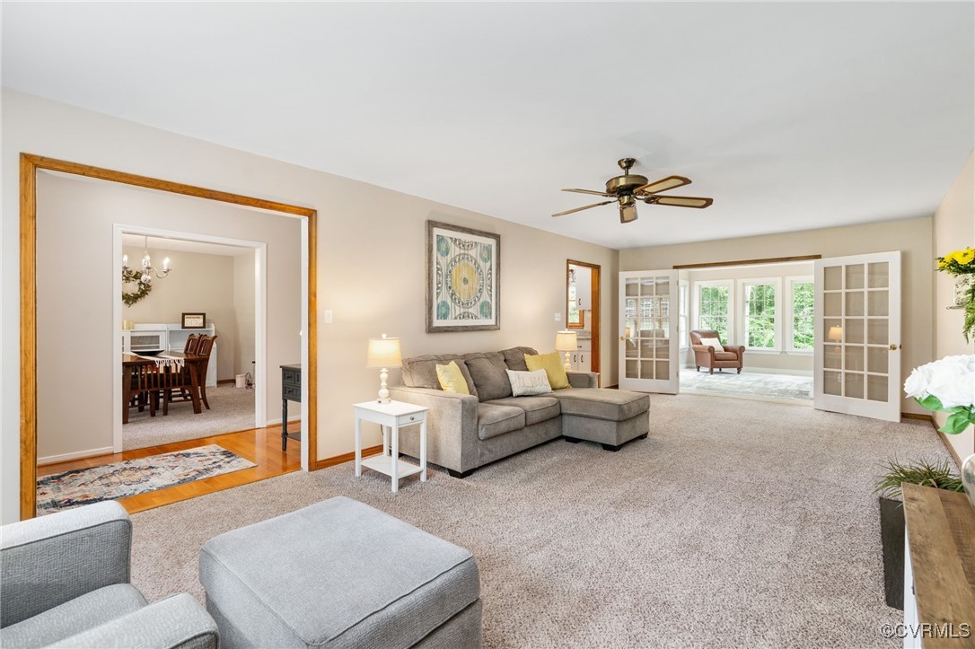 12207 Balta Road Chesterfield, VA 23838 - Photo 10 of 50 Living room with a chandelier, ceiling fan, basebo