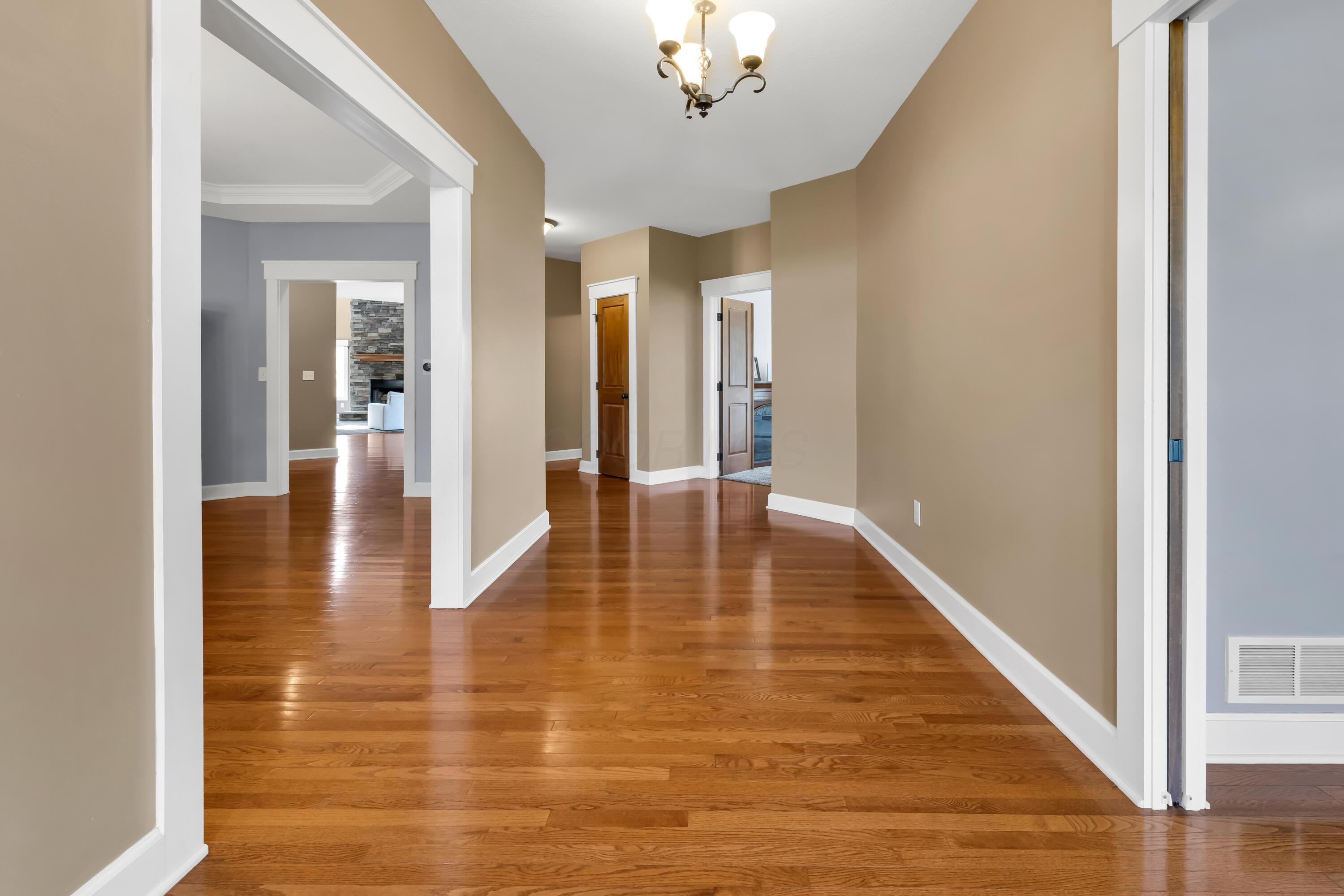 16689 Bailor Road Laurelville, OH 43135 - Photo 6 of 73 • Hardwood flooring
• Tan painted walls
• Leaded glass front door
with sidelights
• Chandelier
• Coat closet
• New front door ~ 2026