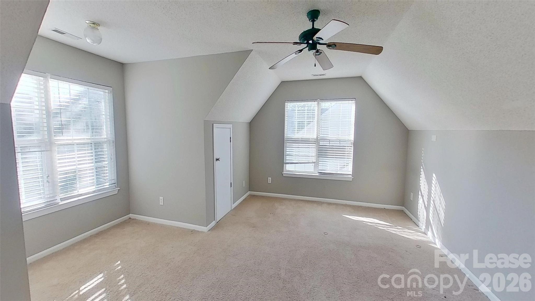 7236 Rock Island Road Charlotte, NC 28278 - Photo 10 of 11 a view of a big room with windows and chandelier fan