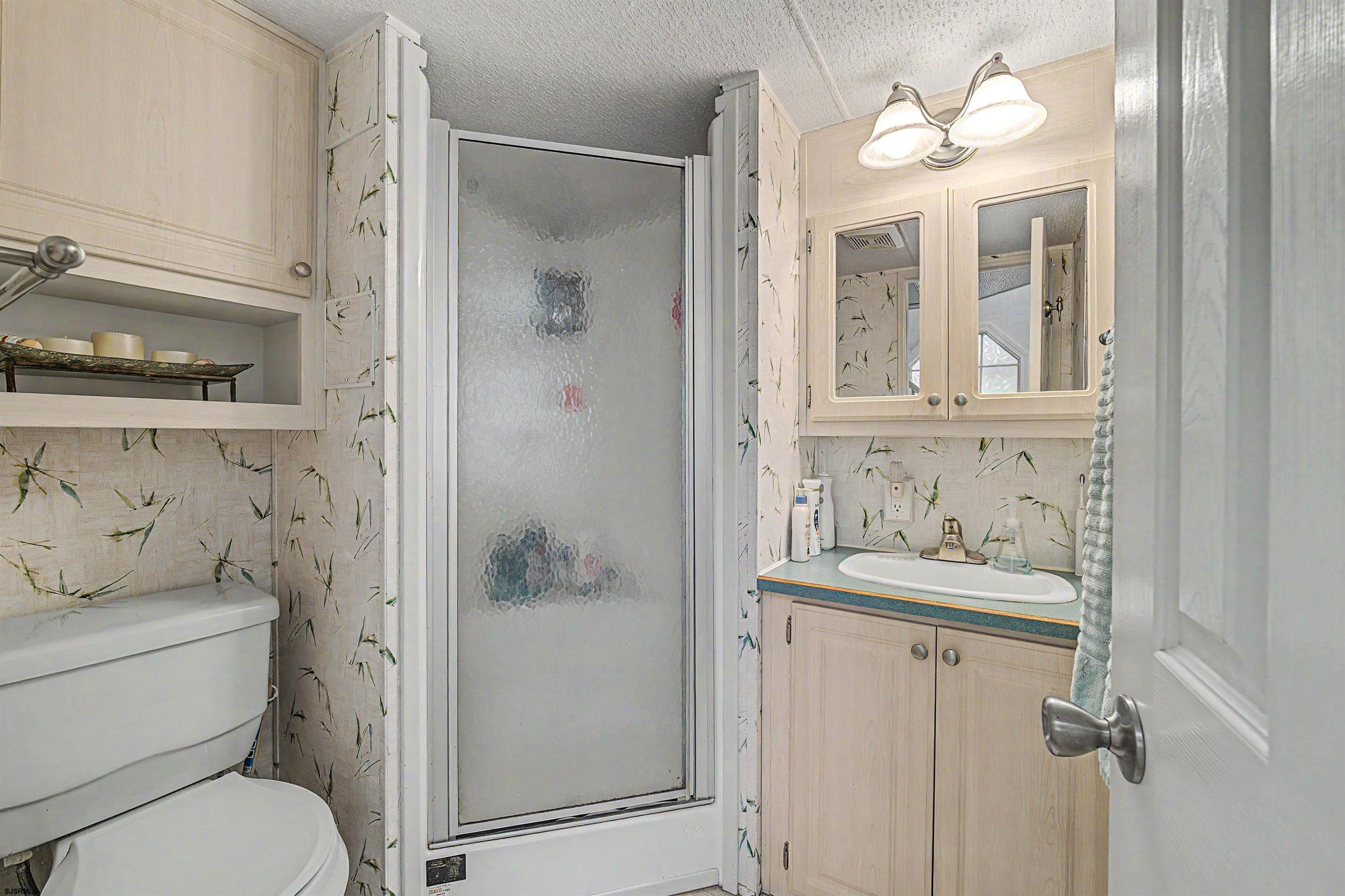 3066 Route 9 Ocean View, NJ 08230 - Photo 16 of 29 a bathroom with a sink toilet and shower
