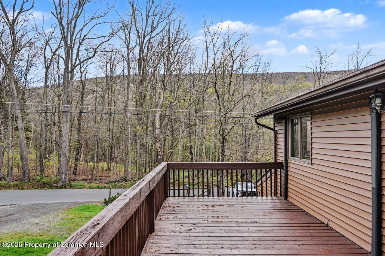 719 Scott Road Clarks Summit, PA 18411 - Photo 38 of 51 a balcony with trees in front of it