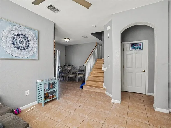 a view of livingroom with furniture and stairs