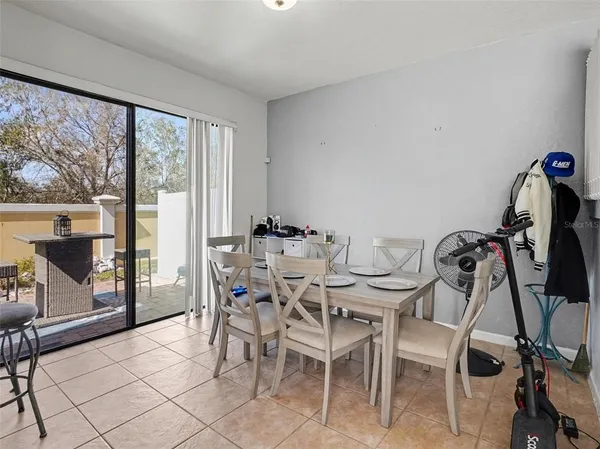 a view of a dining room with furniture window and outside view