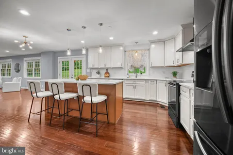 a kitchen with a stove and a sink