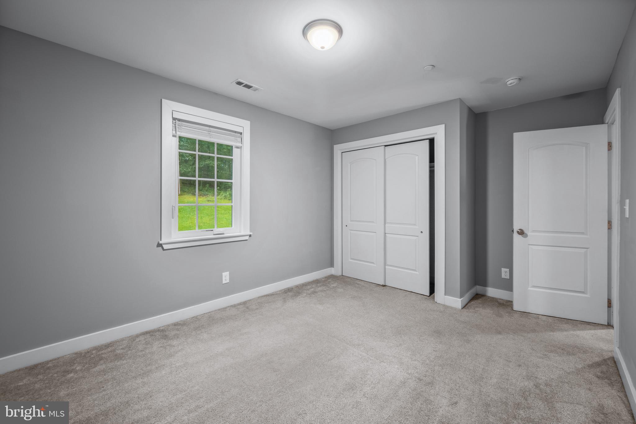 3319 Mail Road Westminster, MD 21157 - Photo 24 of 70 an empty room with windows and closet