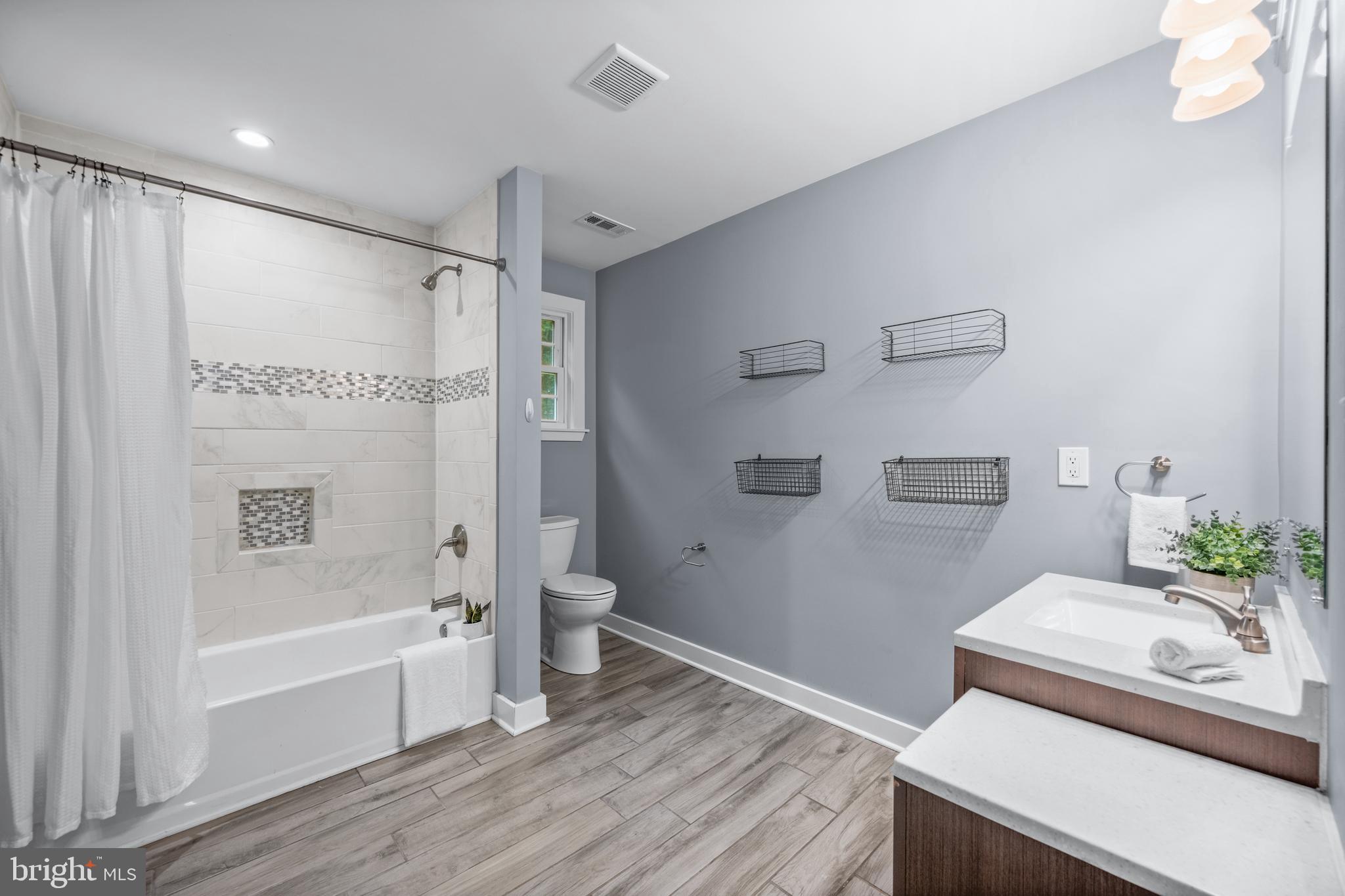3319 Mail Road Westminster, MD 21157 - Photo 25 of 70 a bathroom with a tub toilet and a shower