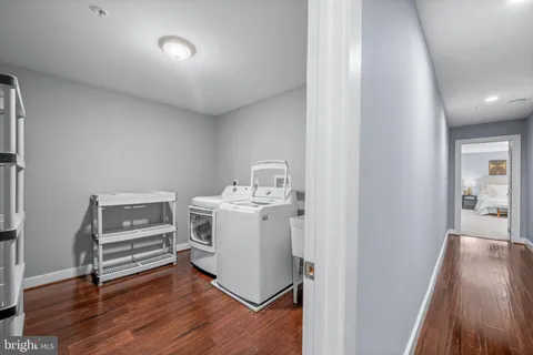 a bathroom with a white bath tub and a shower
