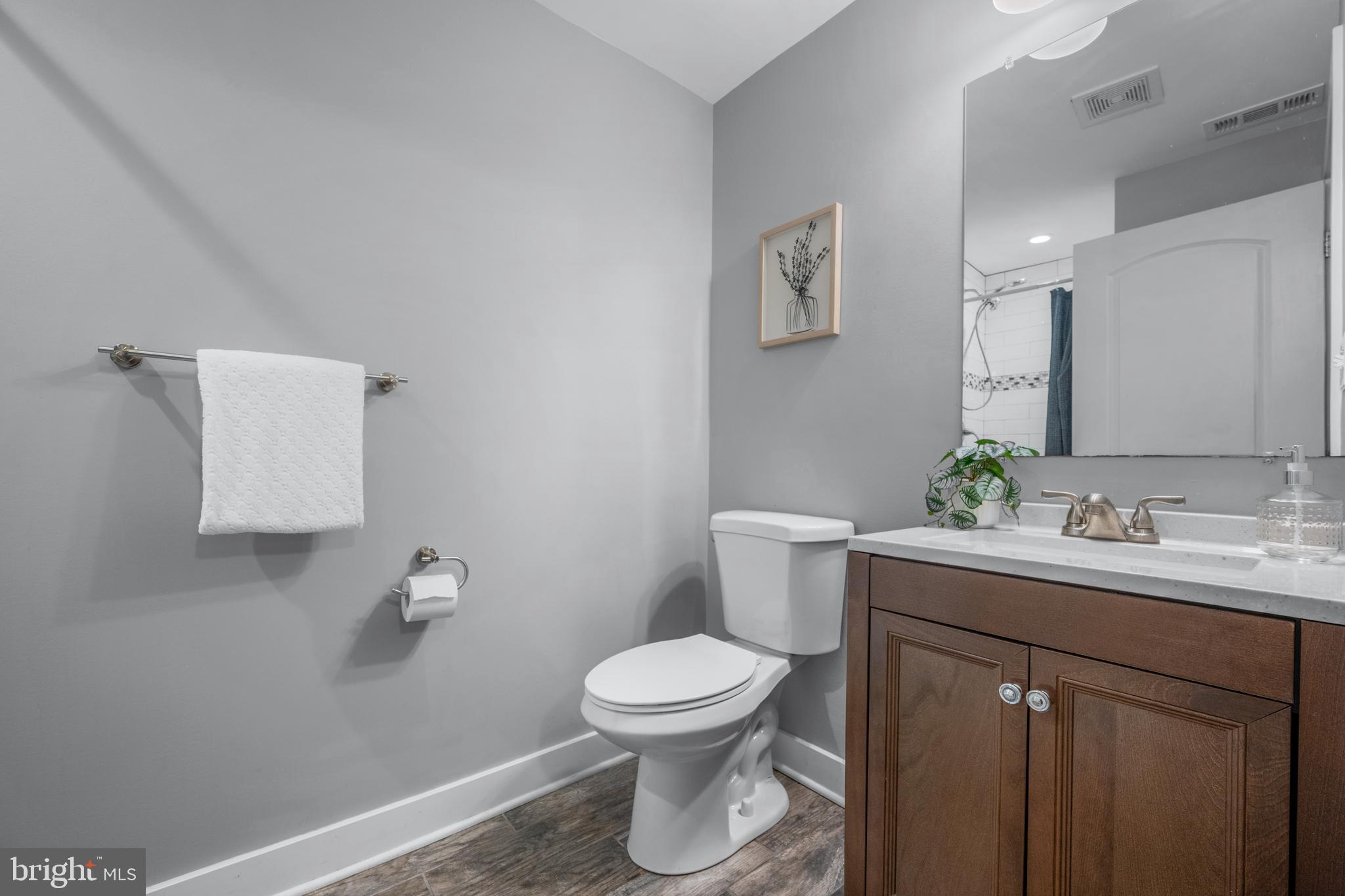 3319 Mail Road Westminster, MD 21157 - Photo 40 of 70 a bathroom with a toilet a sink and mirror