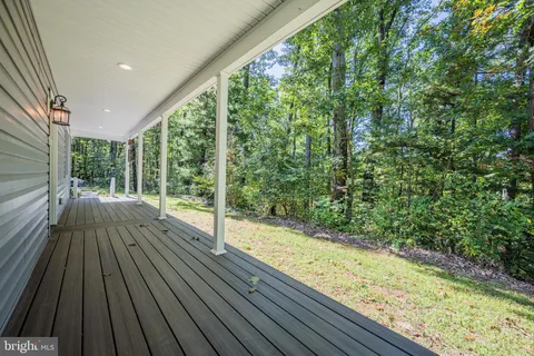 a view of entryway with wooden floor and stairs