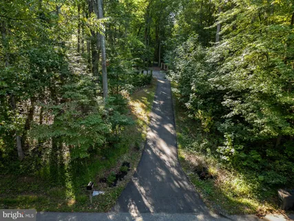 a view of a house with a yard porch and sitting area