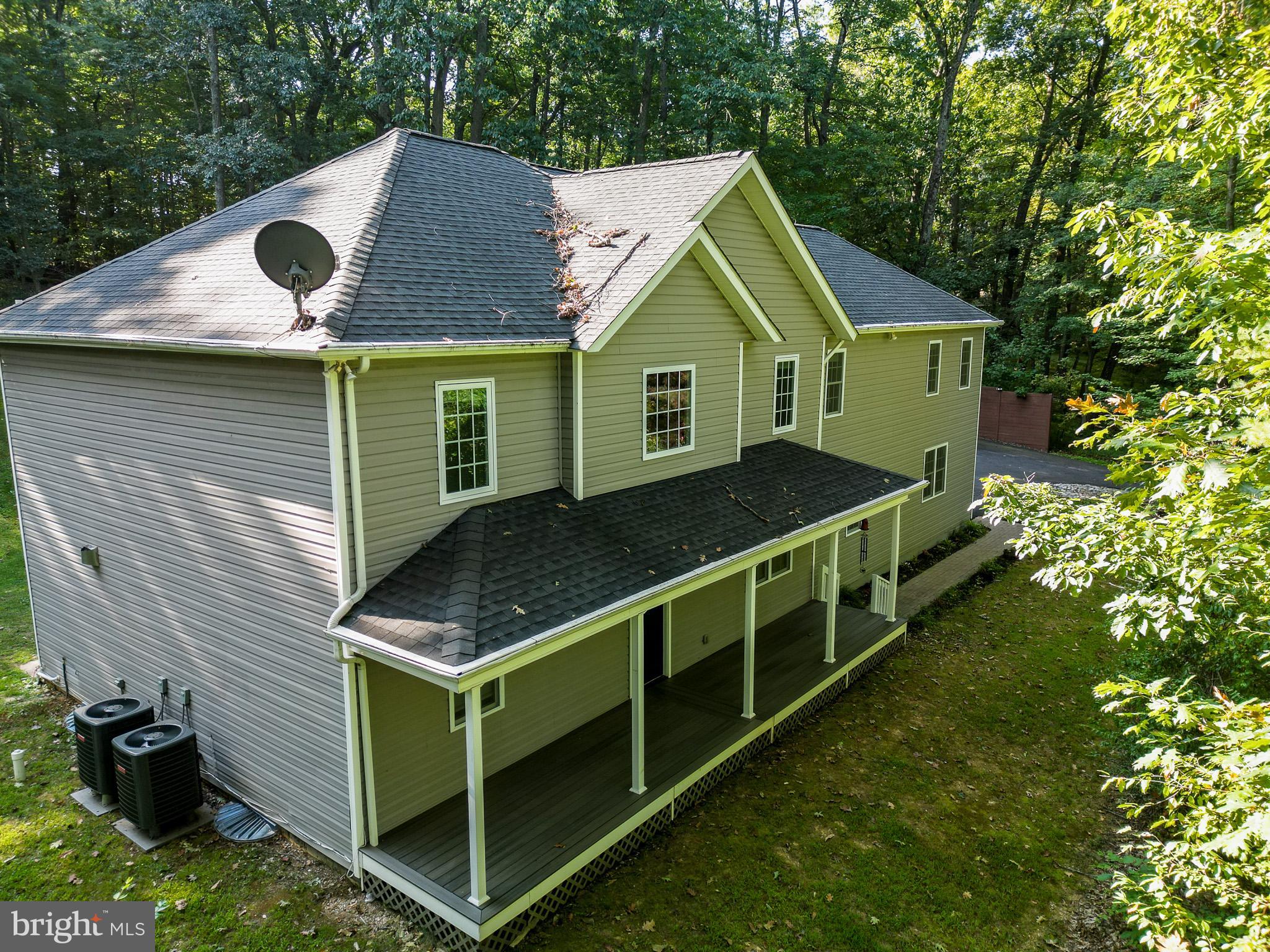 3319 Mail Road Westminster, MD 21157 - Photo 43 of 70 a front view of house with yard and trees in the background