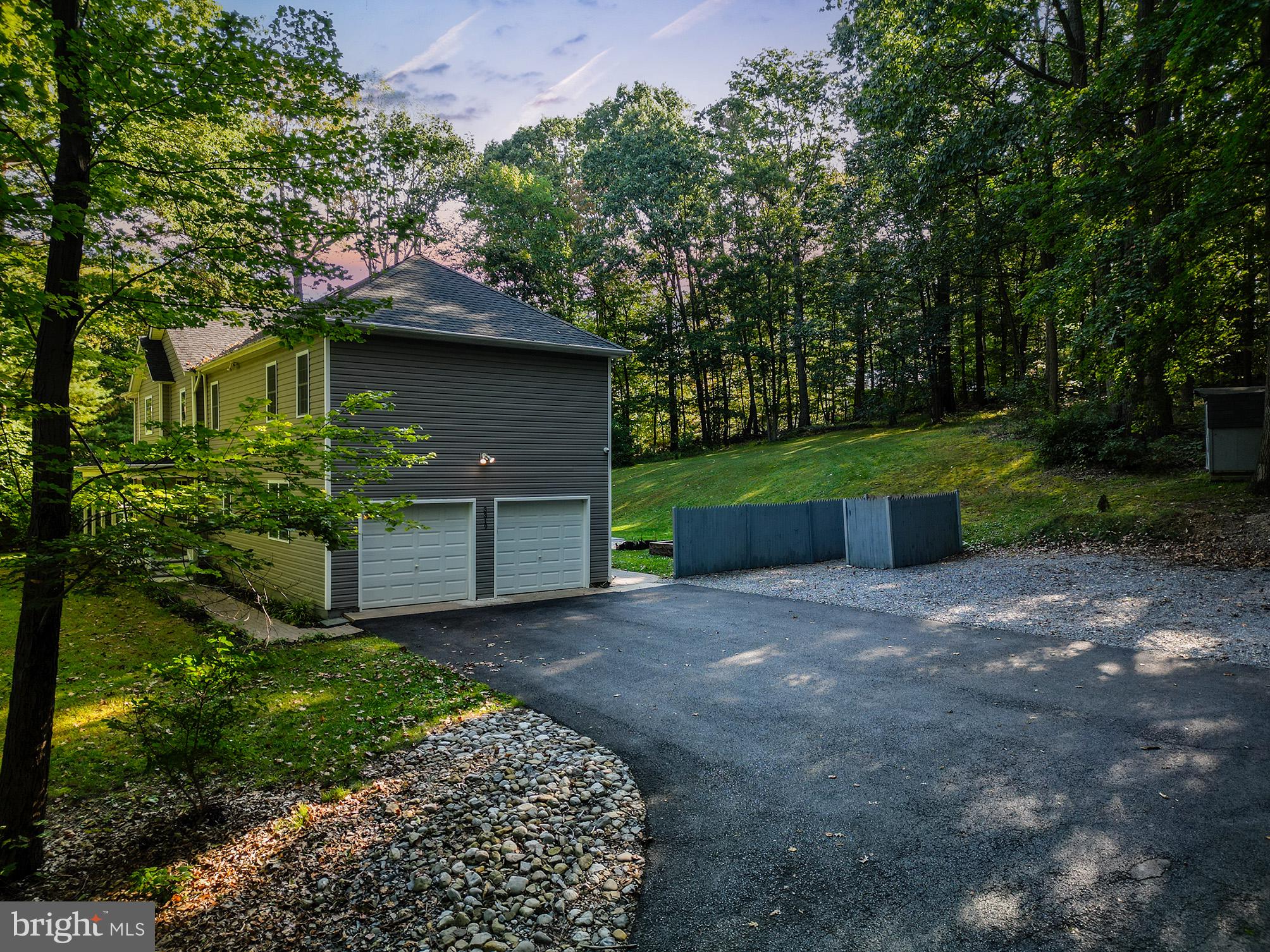 3319 Mail Road Westminster, MD 21157 - Photo 45 of 70 a front view of a house with a yard and garage
