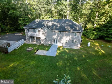 a view of a backyard with sitting area