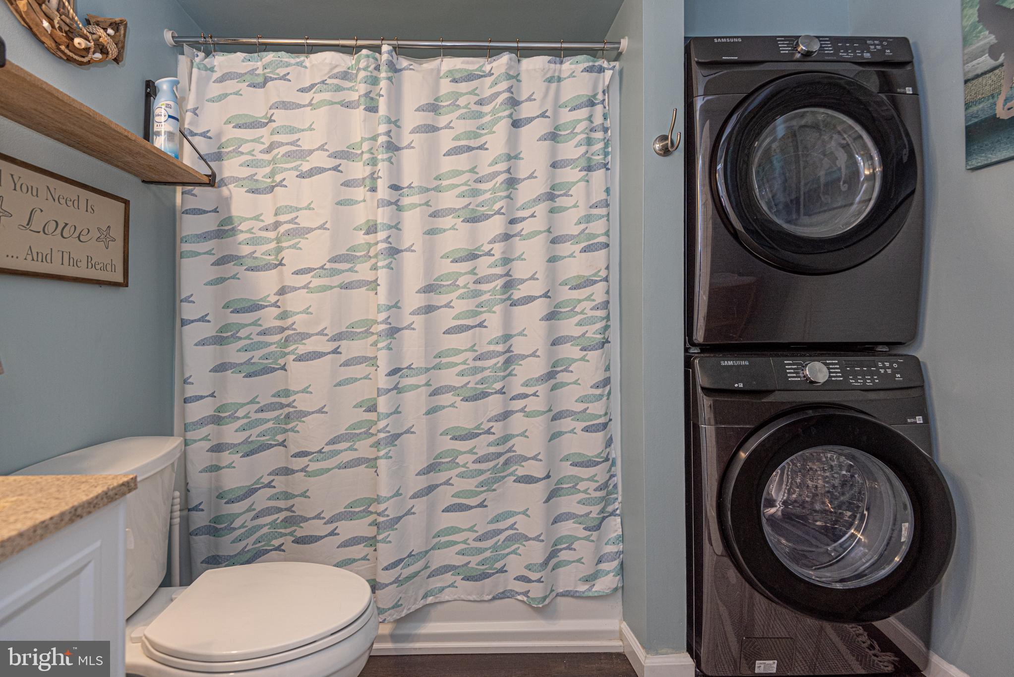 702 Bradley Road, Unit 11 Ocean City, MD 21842 - Photo 14 of 92 a bathroom with a granite countertop toilet and a sink