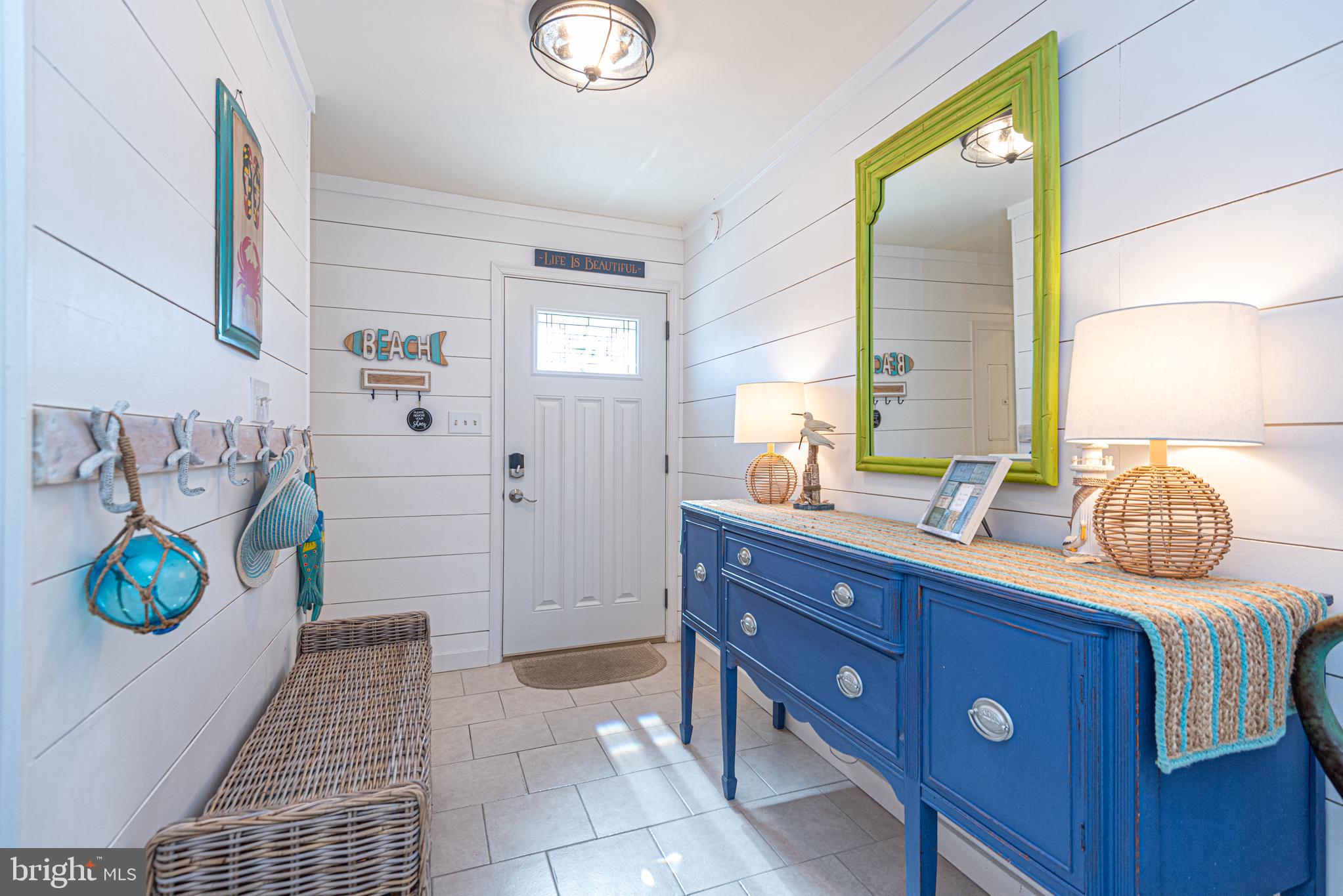 702 Bradley Road, Unit 11 Ocean City, MD 21842 - Photo 2 of 92 a bathroom with a sink a toilet and mirror