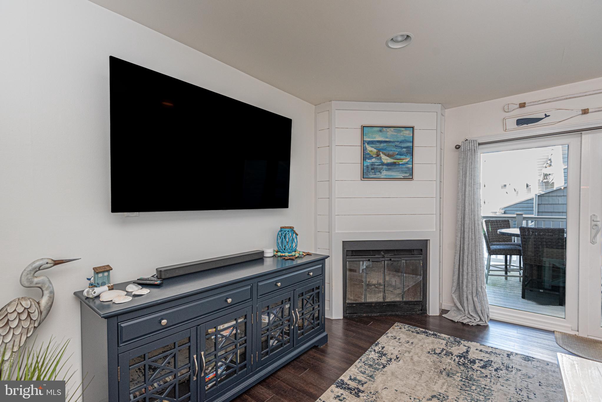 702 Bradley Road, Unit 11 Ocean City, MD 21842 - Photo 29 of 92 a living room with furniture and a flat screen tv