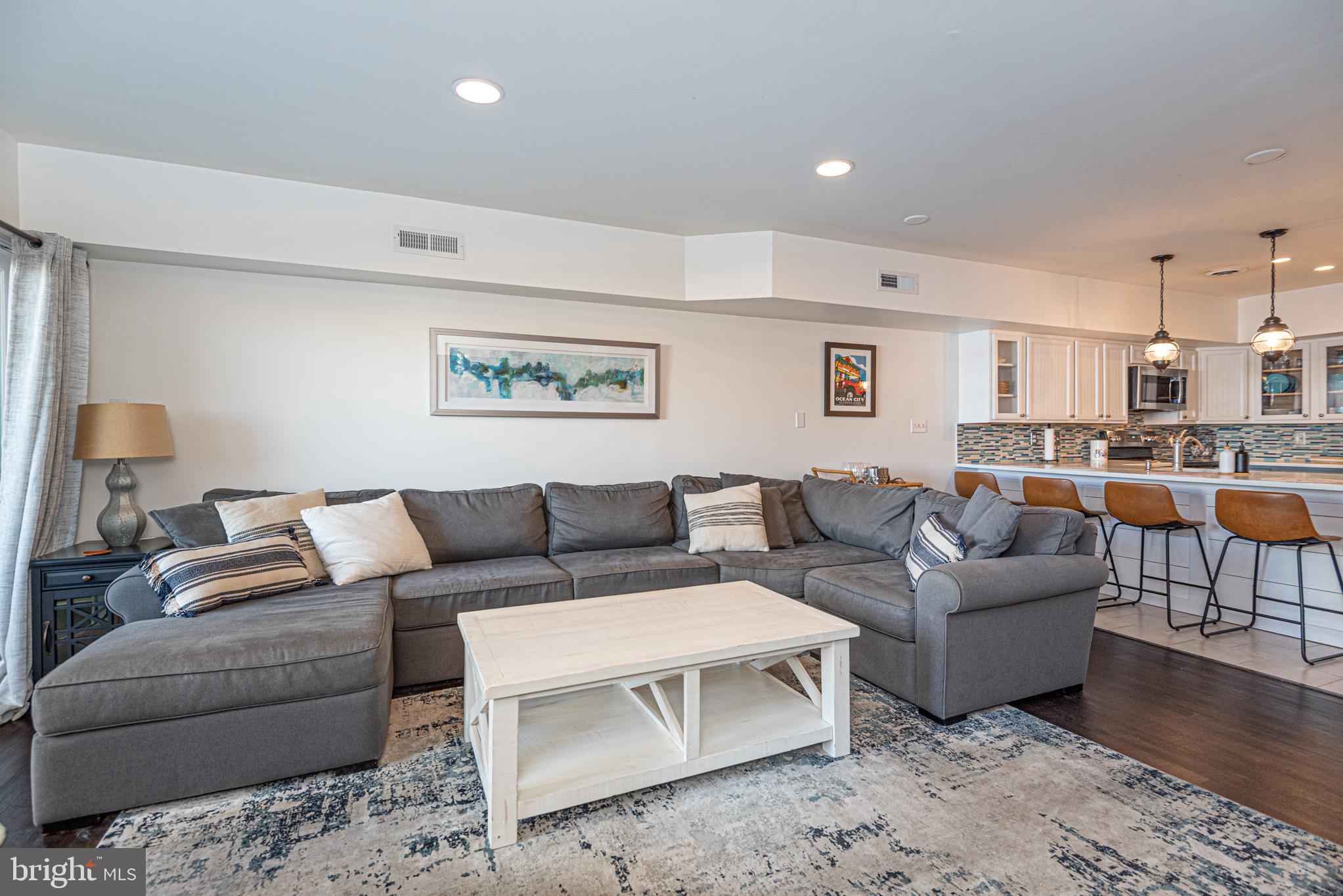 702 Bradley Road, Unit 11 Ocean City, MD 21842 - Photo 30 of 92 a living room with furniture and a view of kitchen