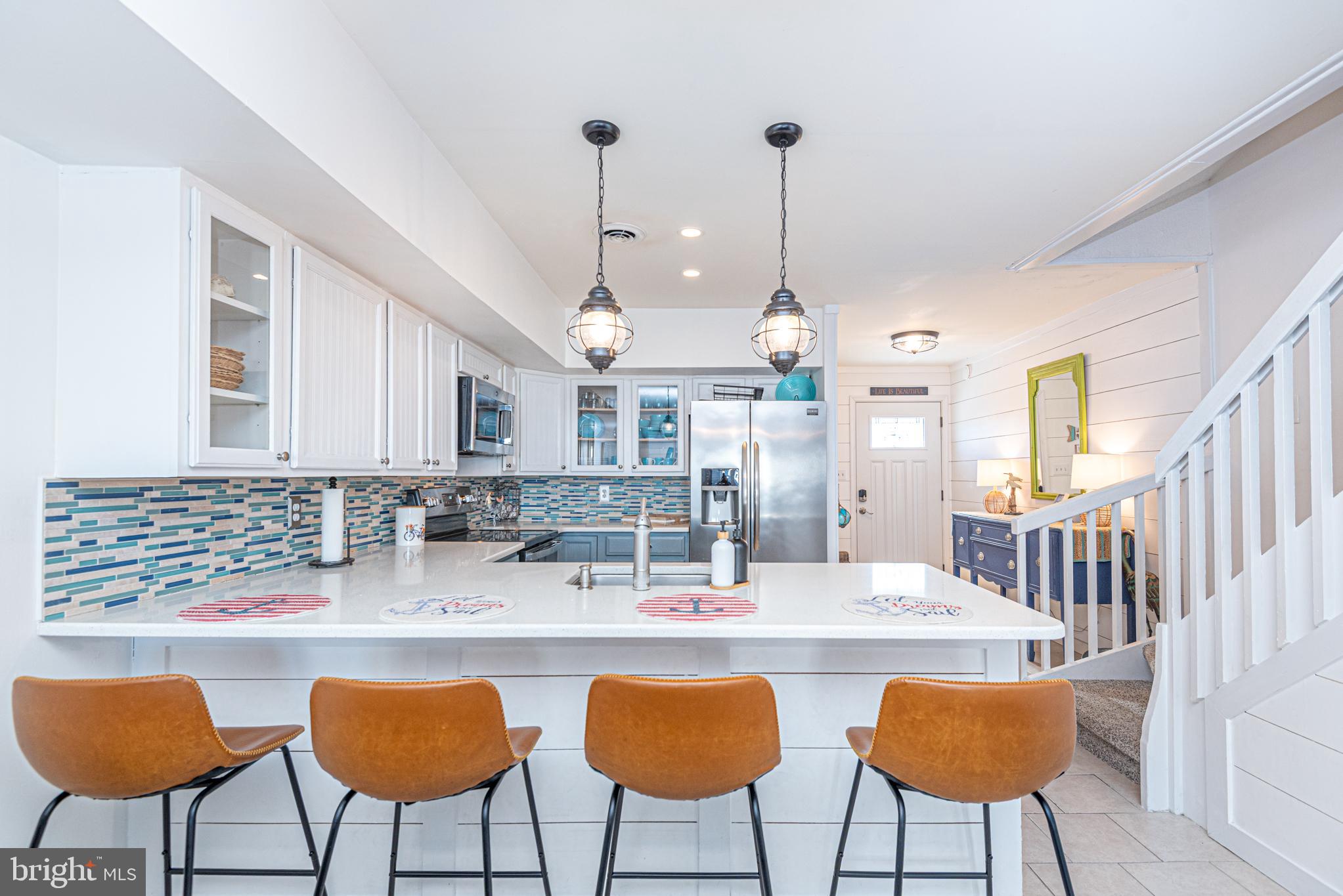 702 Bradley Road, Unit 11 Ocean City, MD 21842 - Photo 3 of 92 Spacious Kitchen with Breakfast Bar