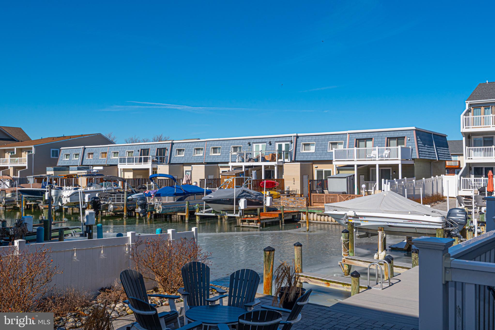 702 Bradley Road, Unit 11 Ocean City, MD 21842 - Photo 35 of 92 a view of a chairs and table in a terrace
