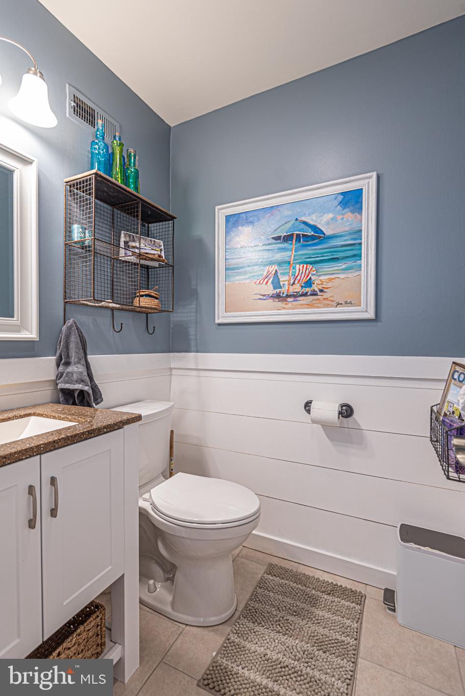 702 Bradley Road, Unit 11 Ocean City, MD 21842 - Photo 37 of 92 a bathroom with a toilet a sink and mirror