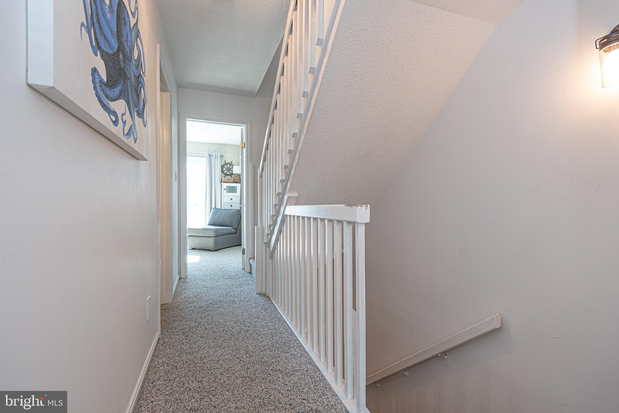 702 Bradley Road, Unit 11 Ocean City, MD 21842 - Photo 40 of 92 a view of a livingroom from a hallway