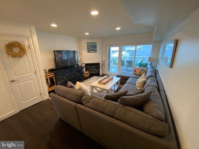 702 Bradley Road, Unit 11 Ocean City, MD 21842 - Photo 4 of 19 Family Room with wood burning fireplace & balcony