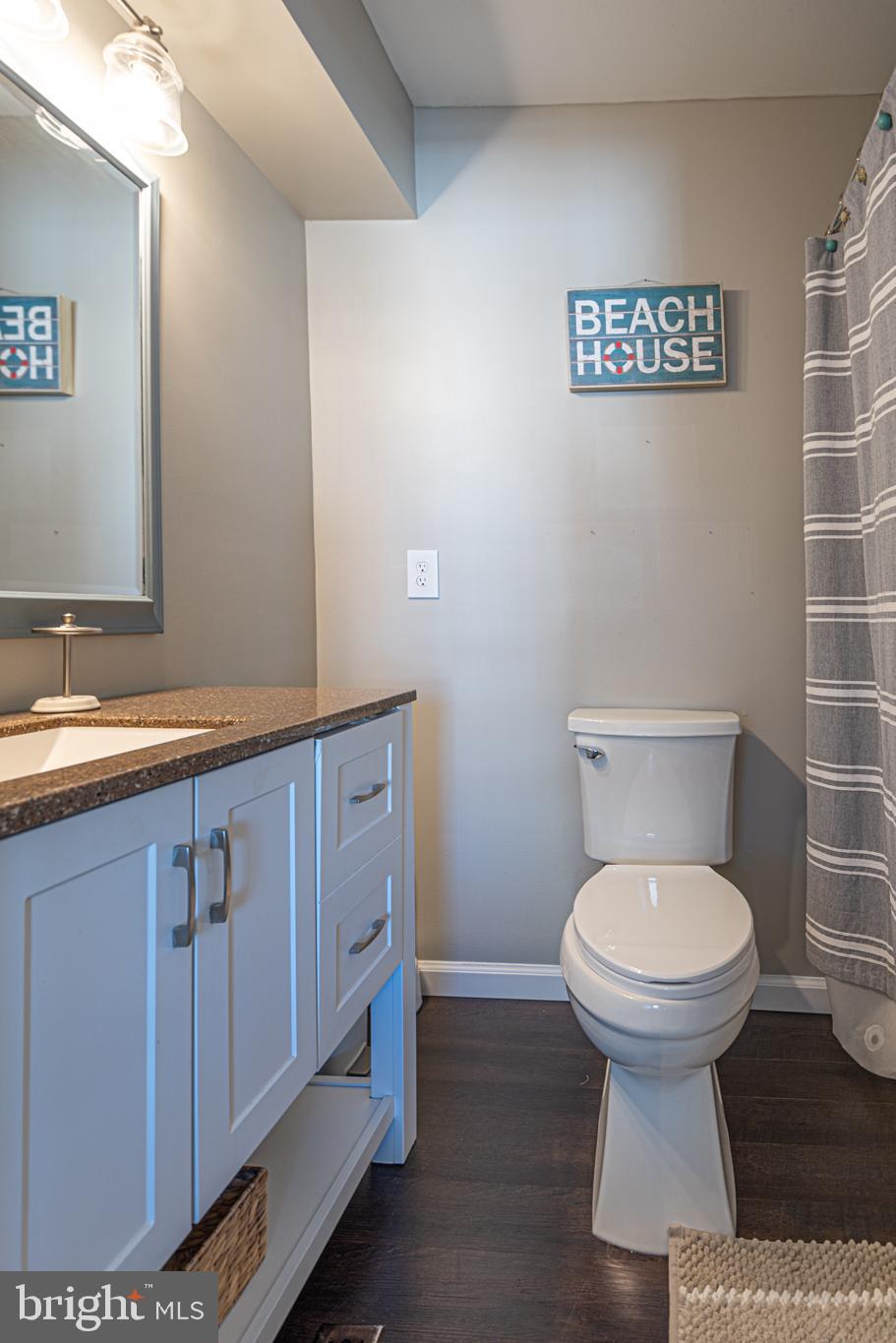 702 Bradley Road, Unit 11 Ocean City, MD 21842 - Photo 46 of 92 a bathroom with a sink and a toilet