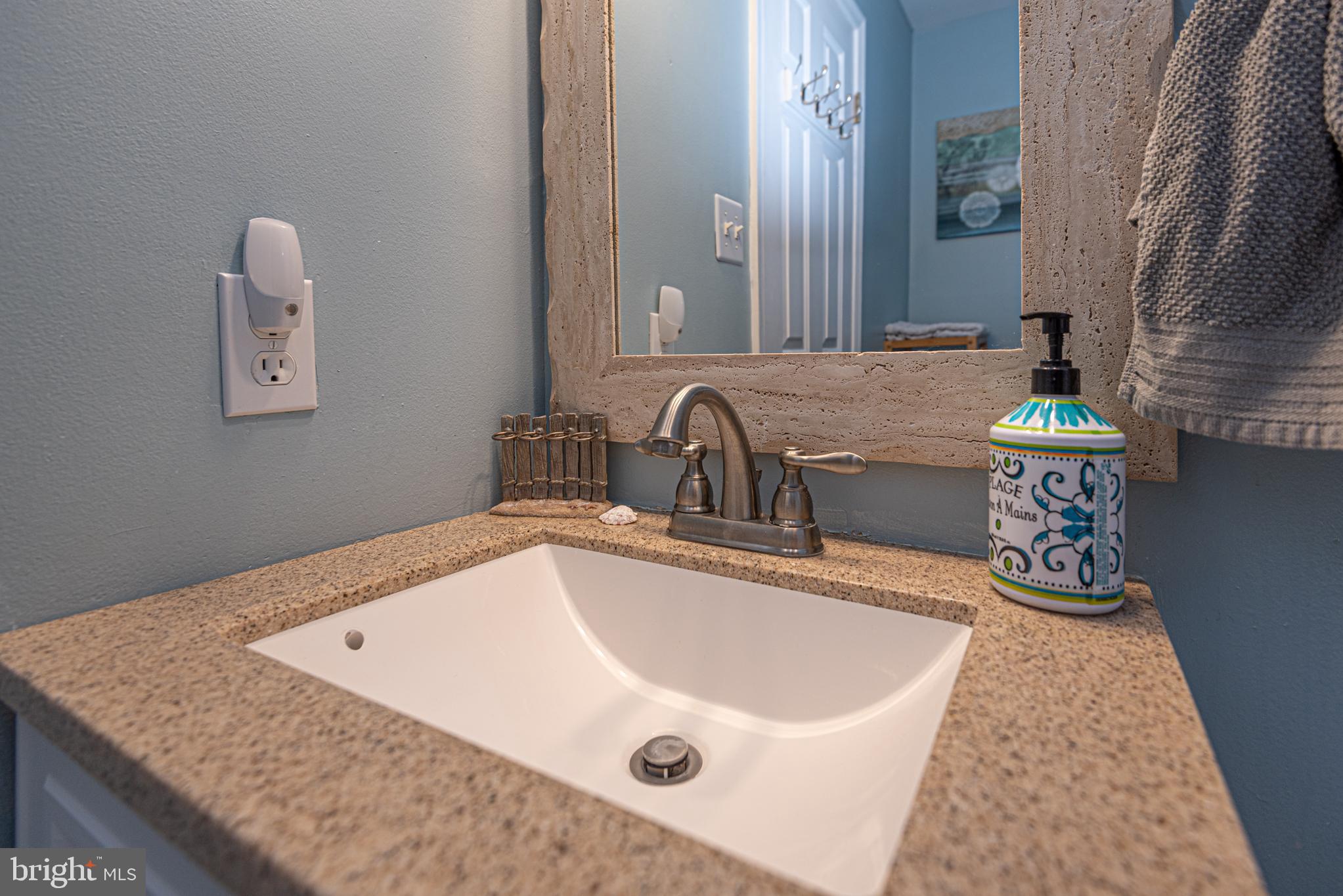 702 Bradley Road, Unit 11 Ocean City, MD 21842 - Photo 54 of 92 a bathroom with a sink and a mirror