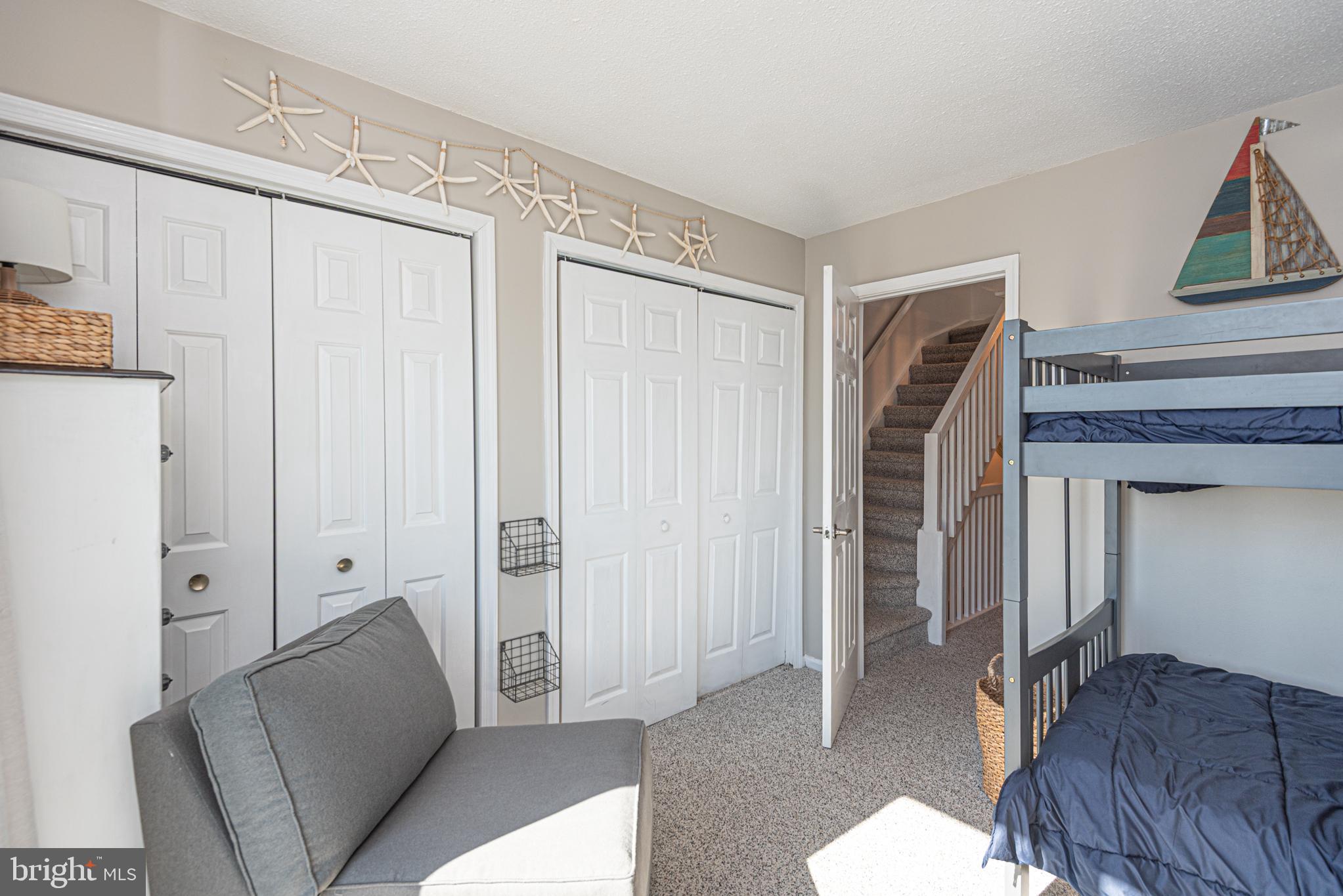 702 Bradley Road, Unit 11 Ocean City, MD 21842 - Photo 55 of 92 a living room with furniture and a couch
