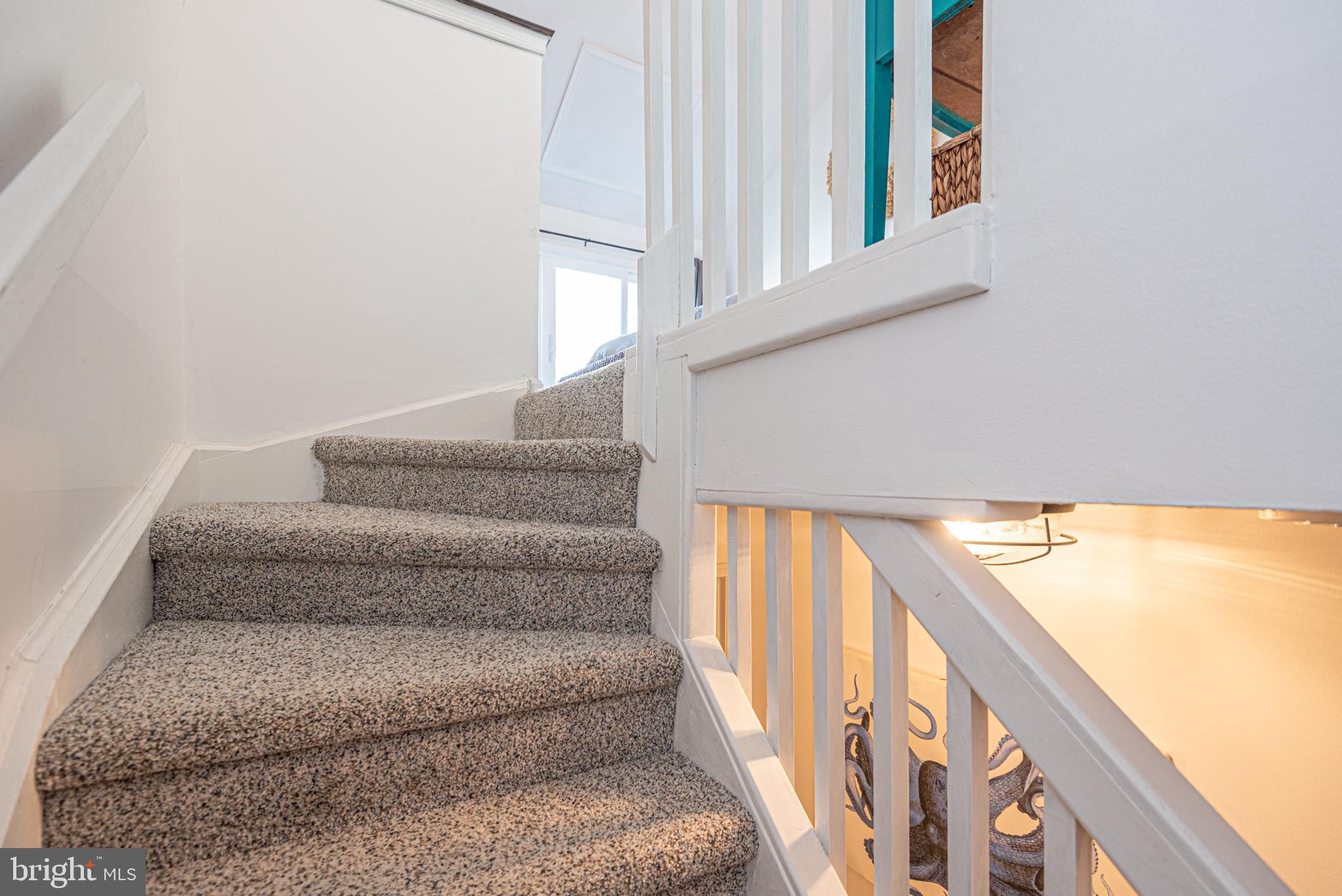 702 Bradley Road, Unit 11 Ocean City, MD 21842 - Photo 59 of 92 a view of staircase with white walls and windows