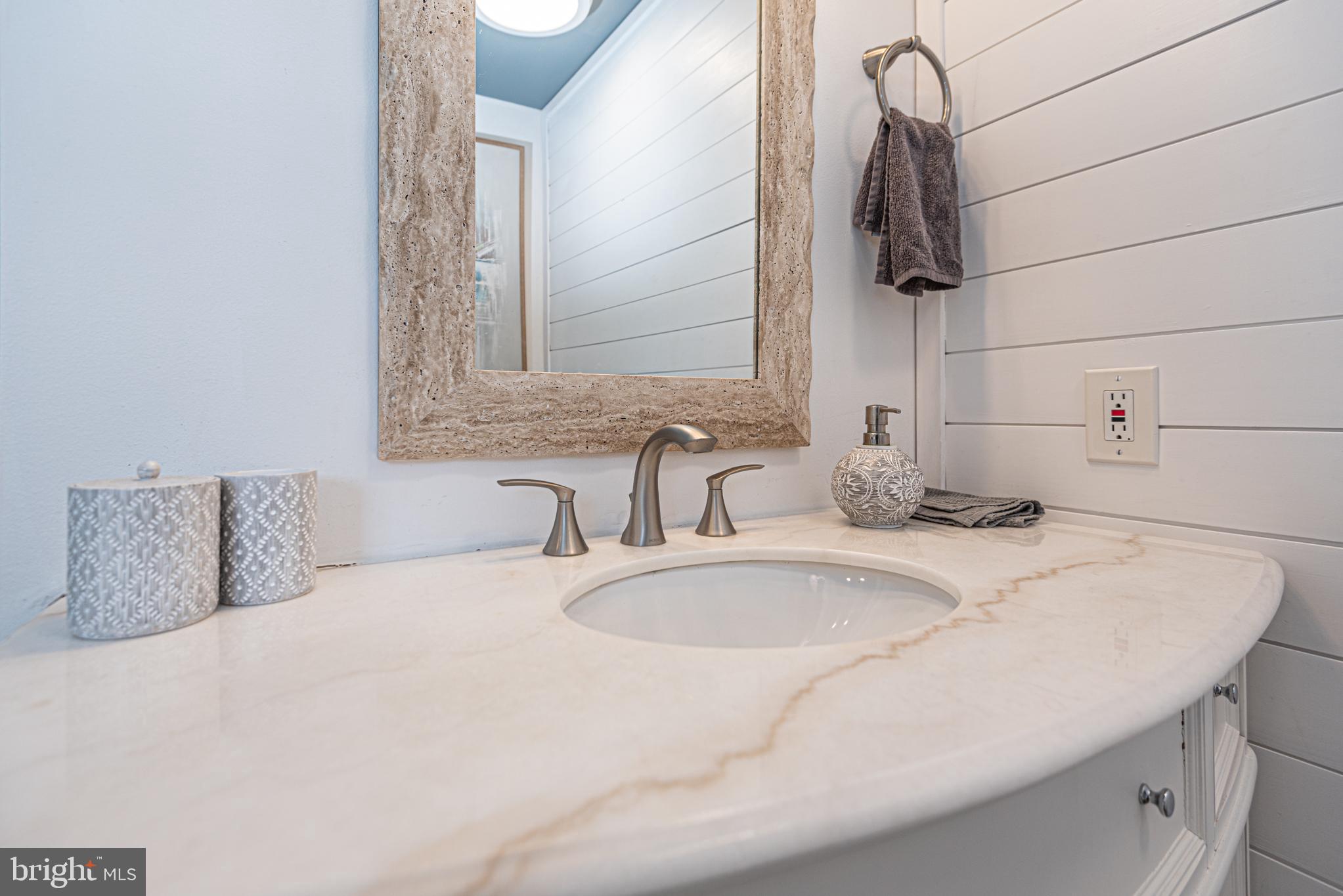 702 Bradley Road, Unit 11 Ocean City, MD 21842 - Photo 65 of 92 a bathroom with a sink and a mirror