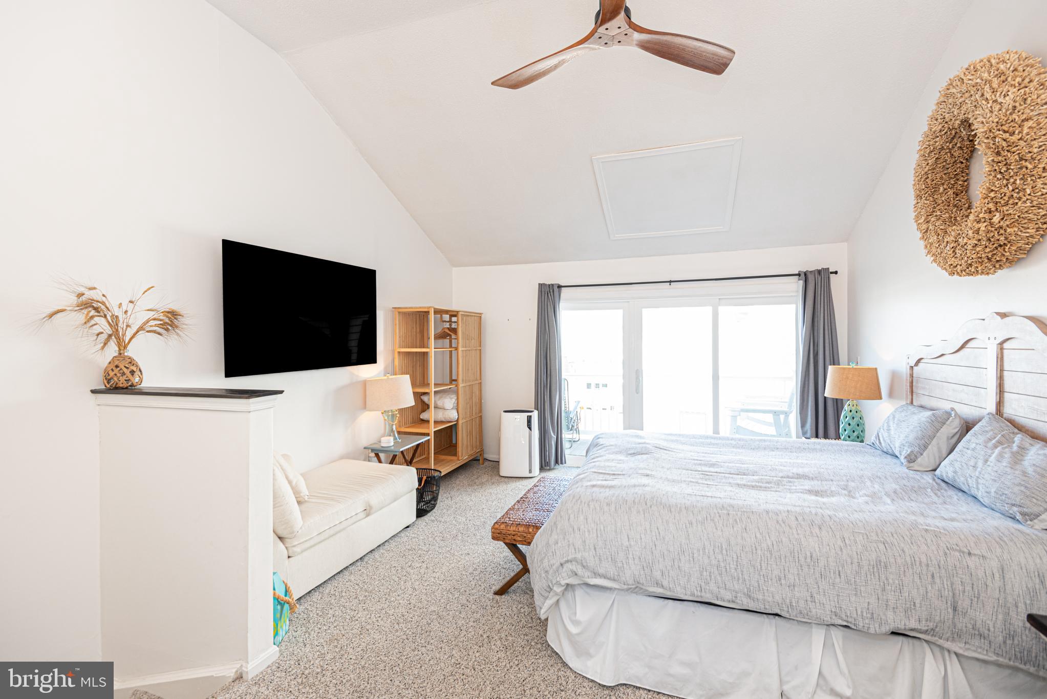 702 Bradley Road, Unit 11 Ocean City, MD 21842 - Photo 68 of 92 a bedroom with a bed and a flat screen tv