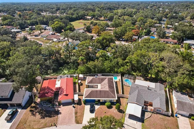an aerial view of a house with a mountain view