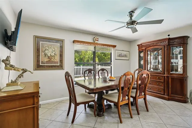 a dining room with furniture and window