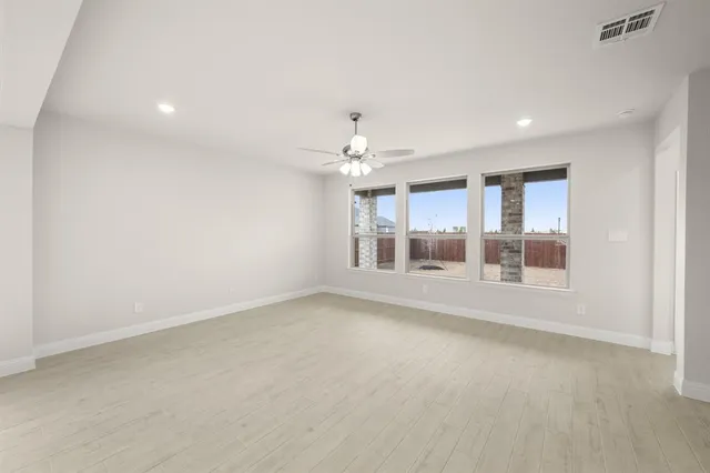 a view of an empty room with a window