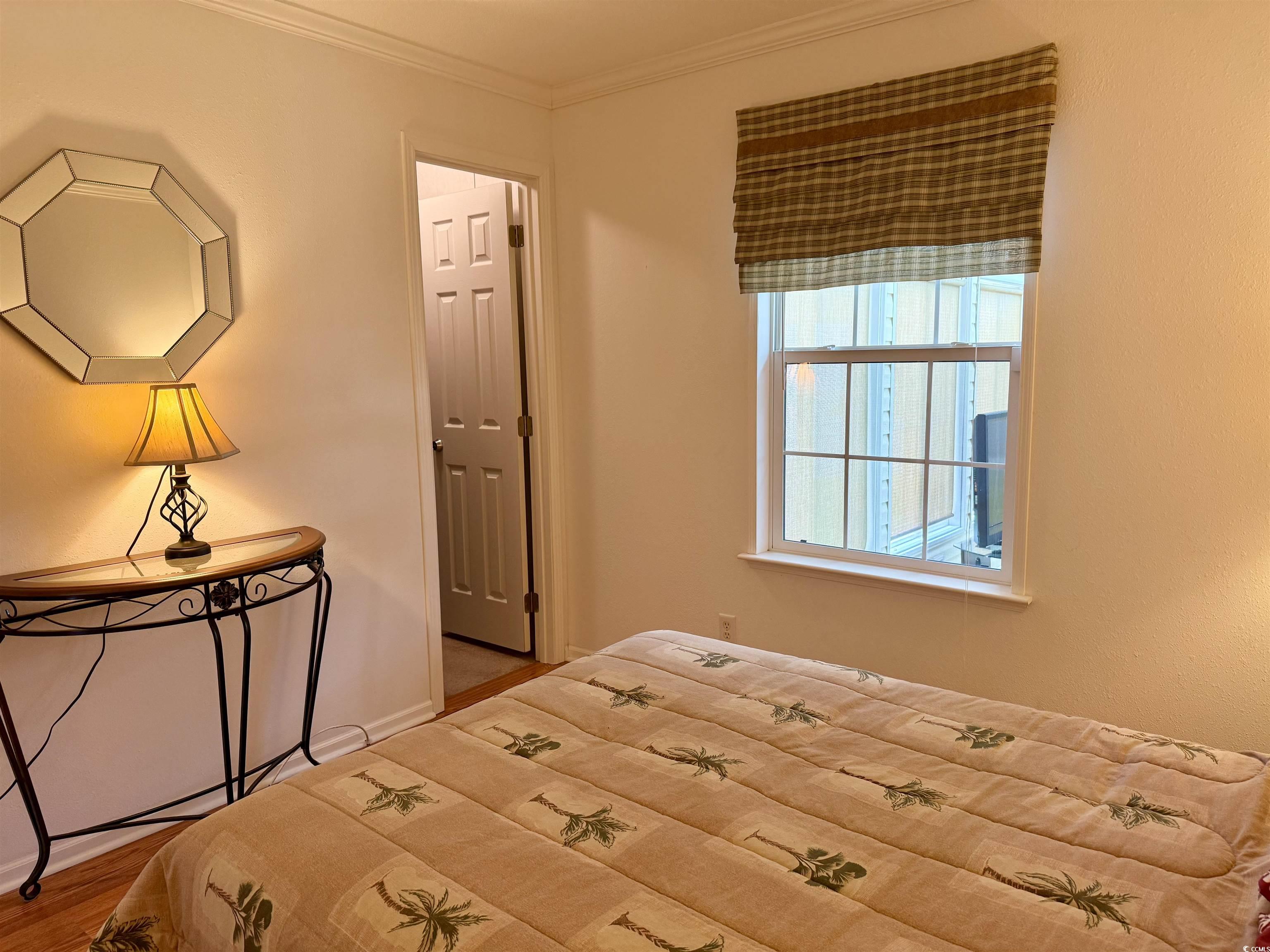 216 Walden Lake Road Conway, SC 29526 - Photo 19 of 40 Bedroom with wood finished floors, ornamental molding, and baseboards