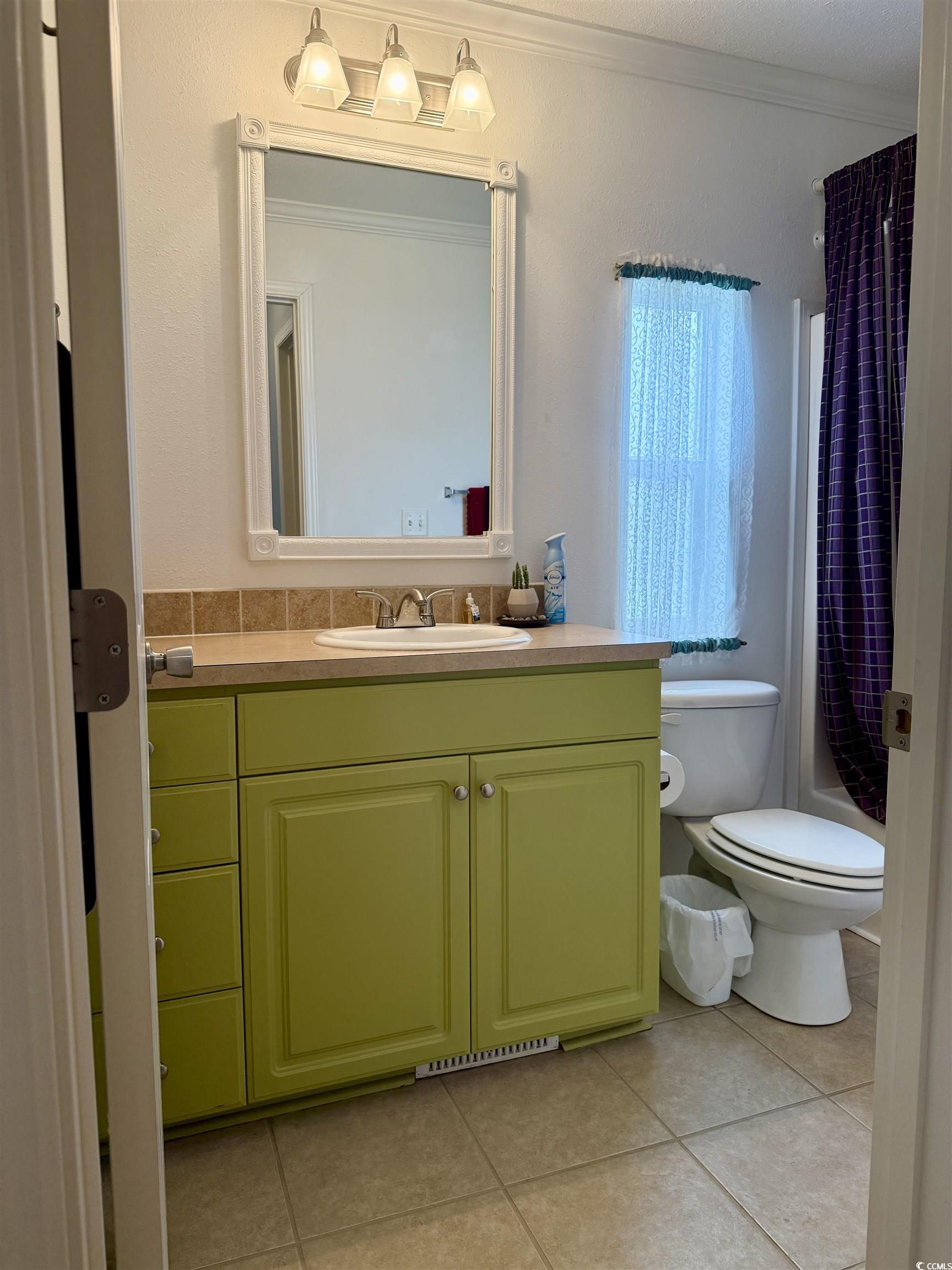 216 Walden Lake Road Conway, SC 29526 - Photo 23 of 40 Full bath with vanity, tile patterned flooring, ornamental molding, toilet, and shower / tub combo