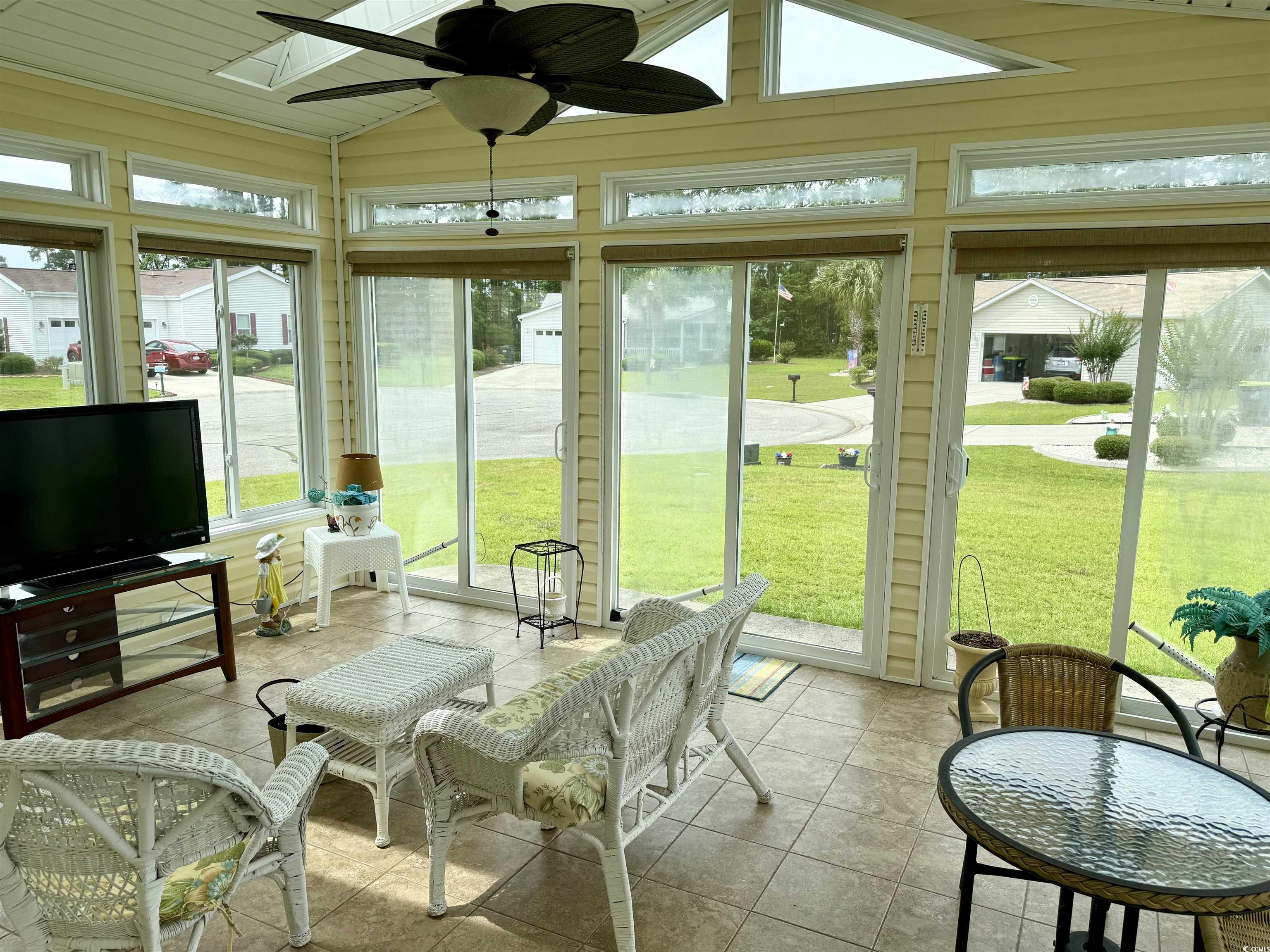 216 Walden Lake Road Conway, SC 29526 - Photo 26 of 40 Sunroom with vaulted ceiling, a skylight, and ceiling fan