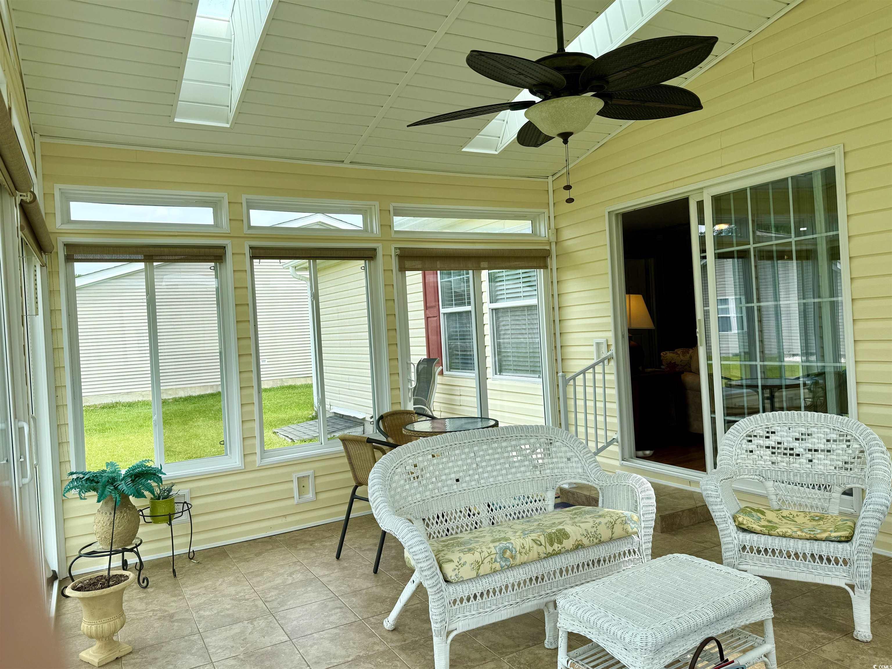 216 Walden Lake Road Conway, SC 29526 - Photo 28 of 40 Sunroom with ceiling fan, vaulted ceiling, and a skylight