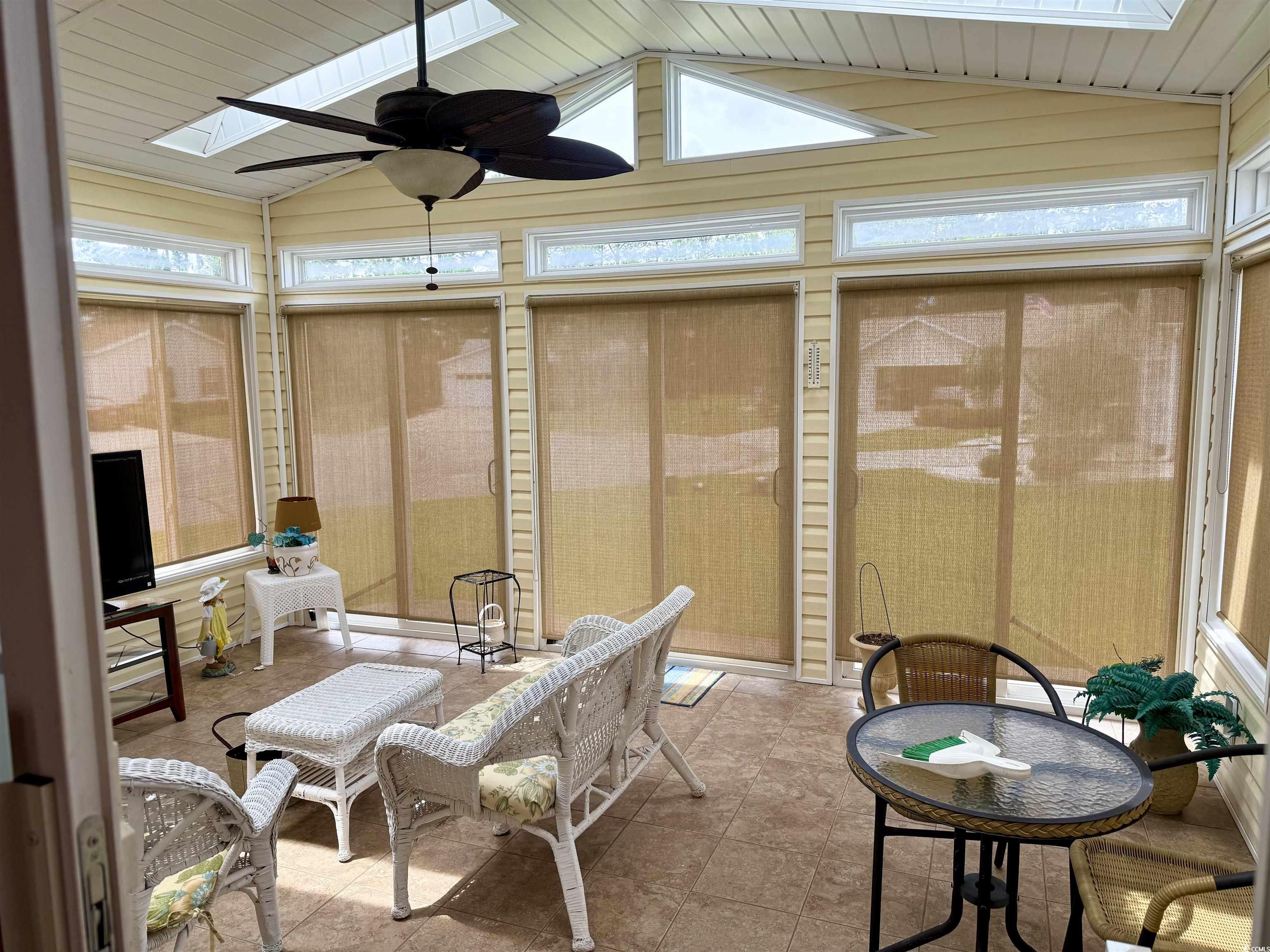 216 Walden Lake Road Conway, SC 29526 - Photo 29 of 40 Sunroom featuring a skylight, a ceiling fan, and vaulted ceiling