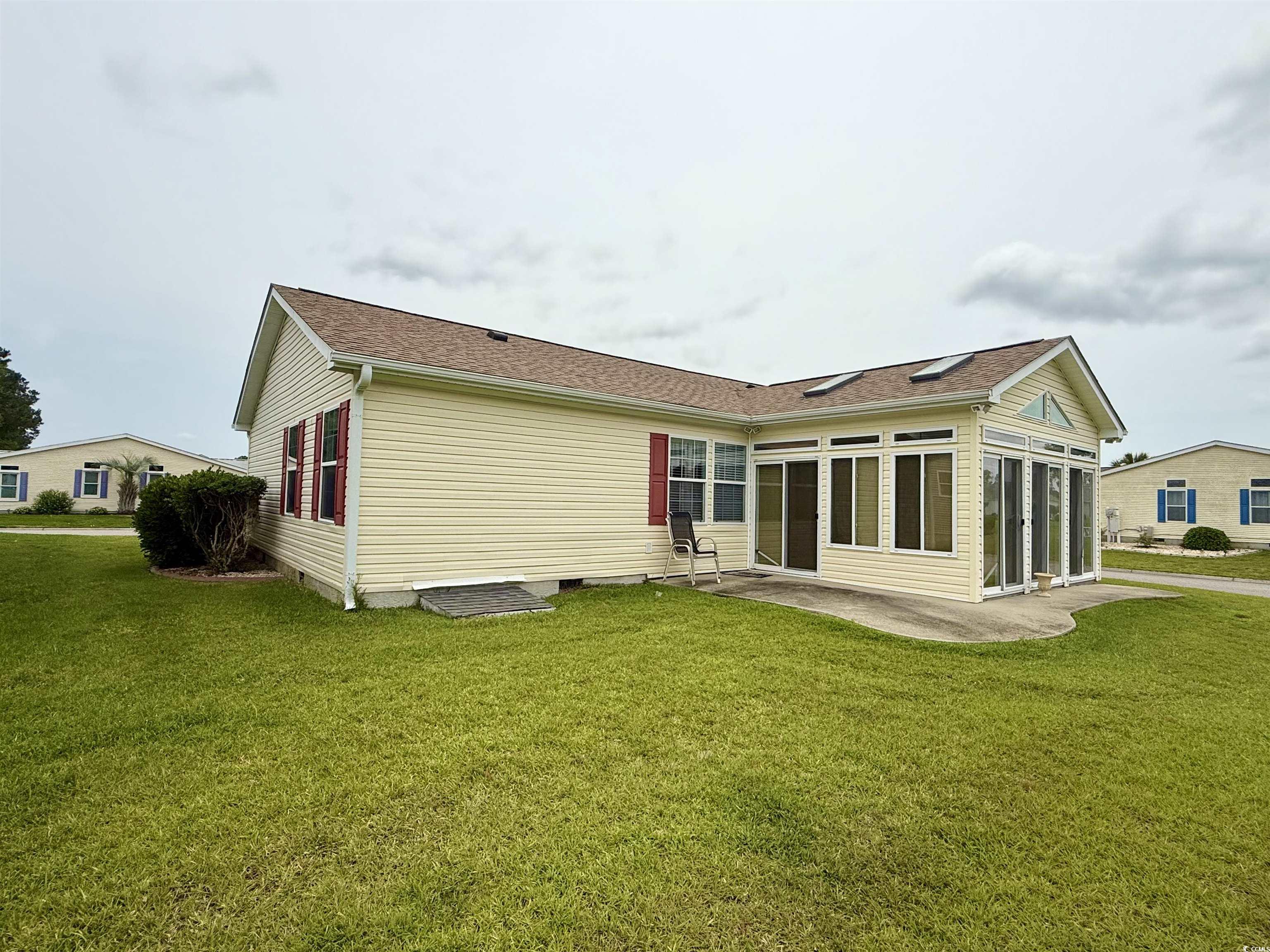 216 Walden Lake Road Conway, SC 29526 - Photo 3 of 40 Rear view of property featuring a patio area, a lawn, crawl space, and roof with shingles