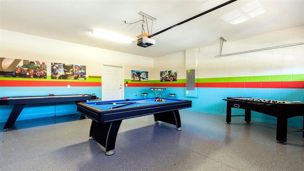 8894 Qin Loop Davenport, FL 33896 - Photo 23 of 47 a room with pool table and windows